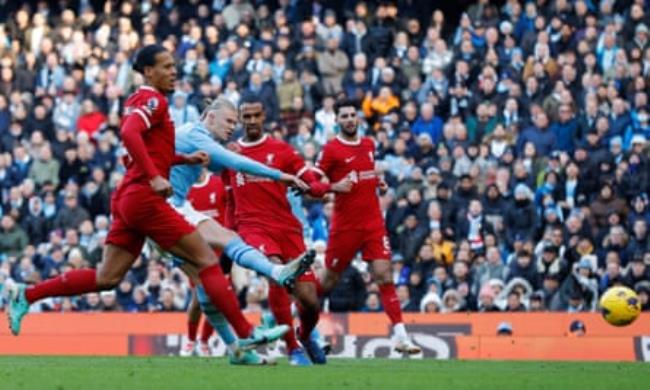 Manchester City’s Erling Haaland scores to make it 1-0 against Liverpool.